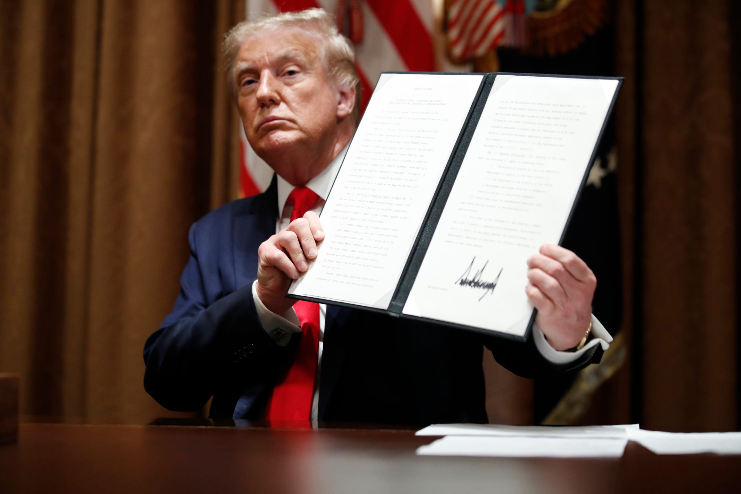 Trump signs executive order on ‘hiring American’